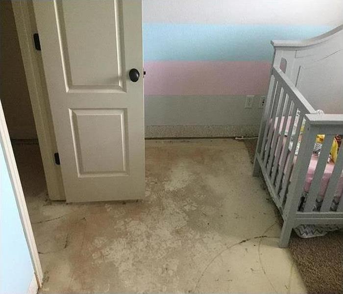 Nursery room with carpet removed after drying